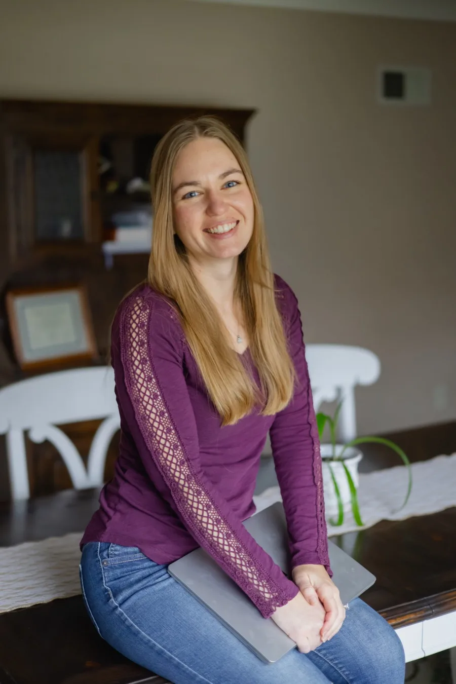 Abigail Parker, Certified Nutritional Therapy Practitioner, seated with a laptop, ready to lead a corporate wellness program